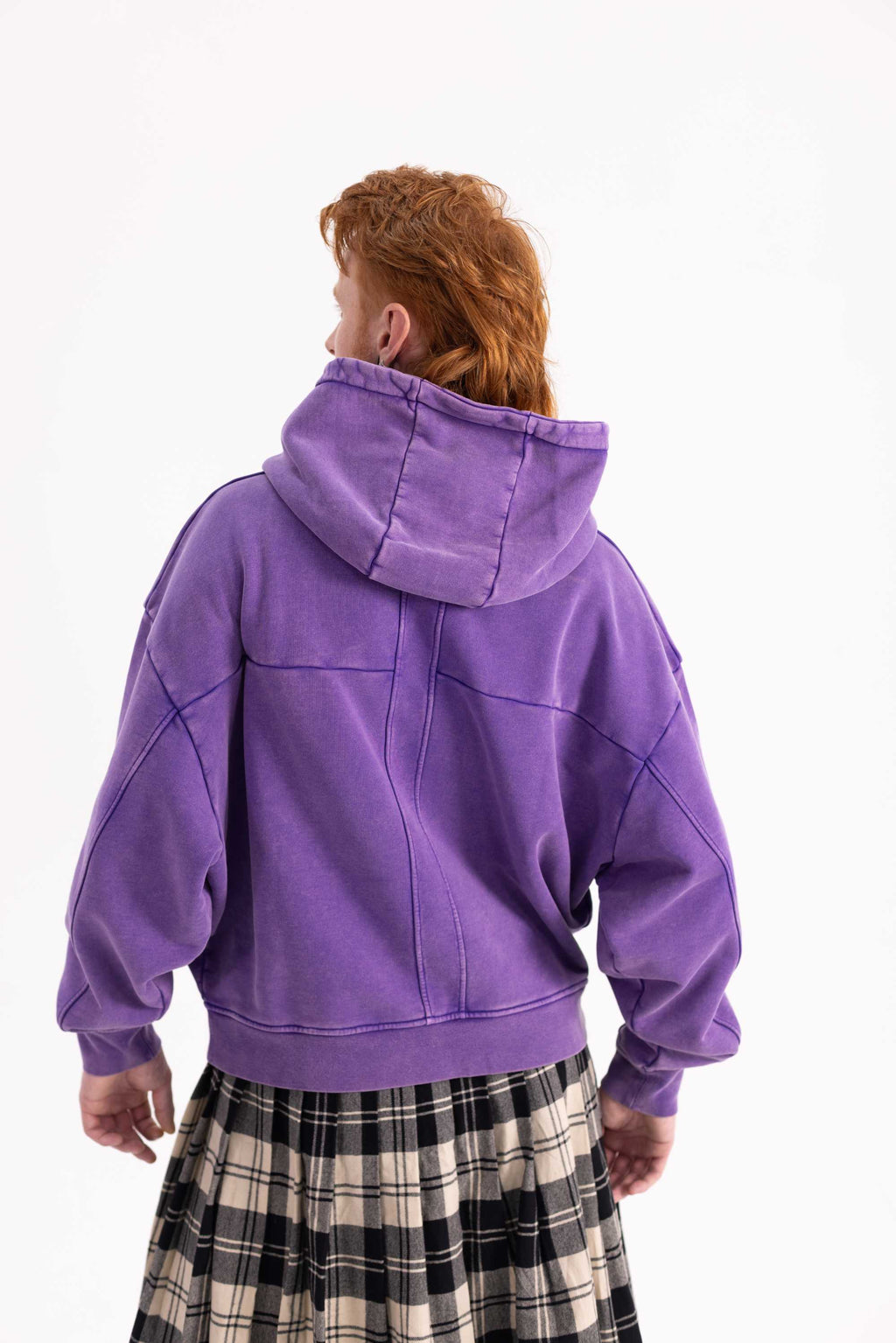 Back view of Matthijs wearing Achilles and the Tortoise  purple hoodie with focus on hood and back details of silouette. Amsterdam sustainable streetwear.